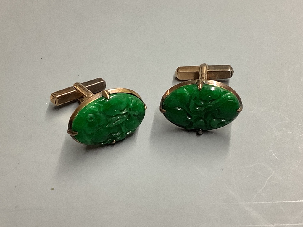 A pair of Chinese 14K gold and green jade oval cufflinks